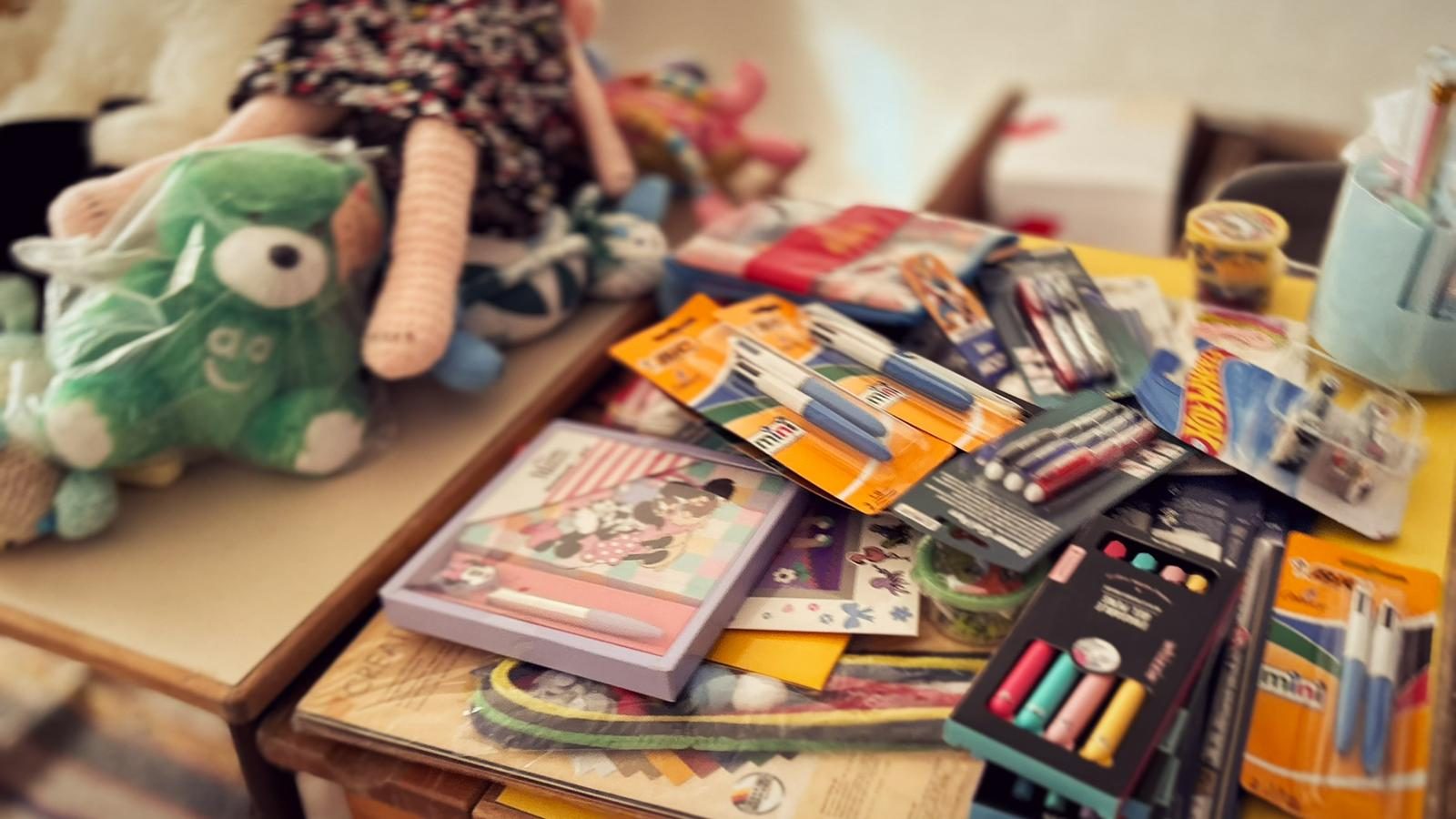 Art supplies and soft toys laid out for activities